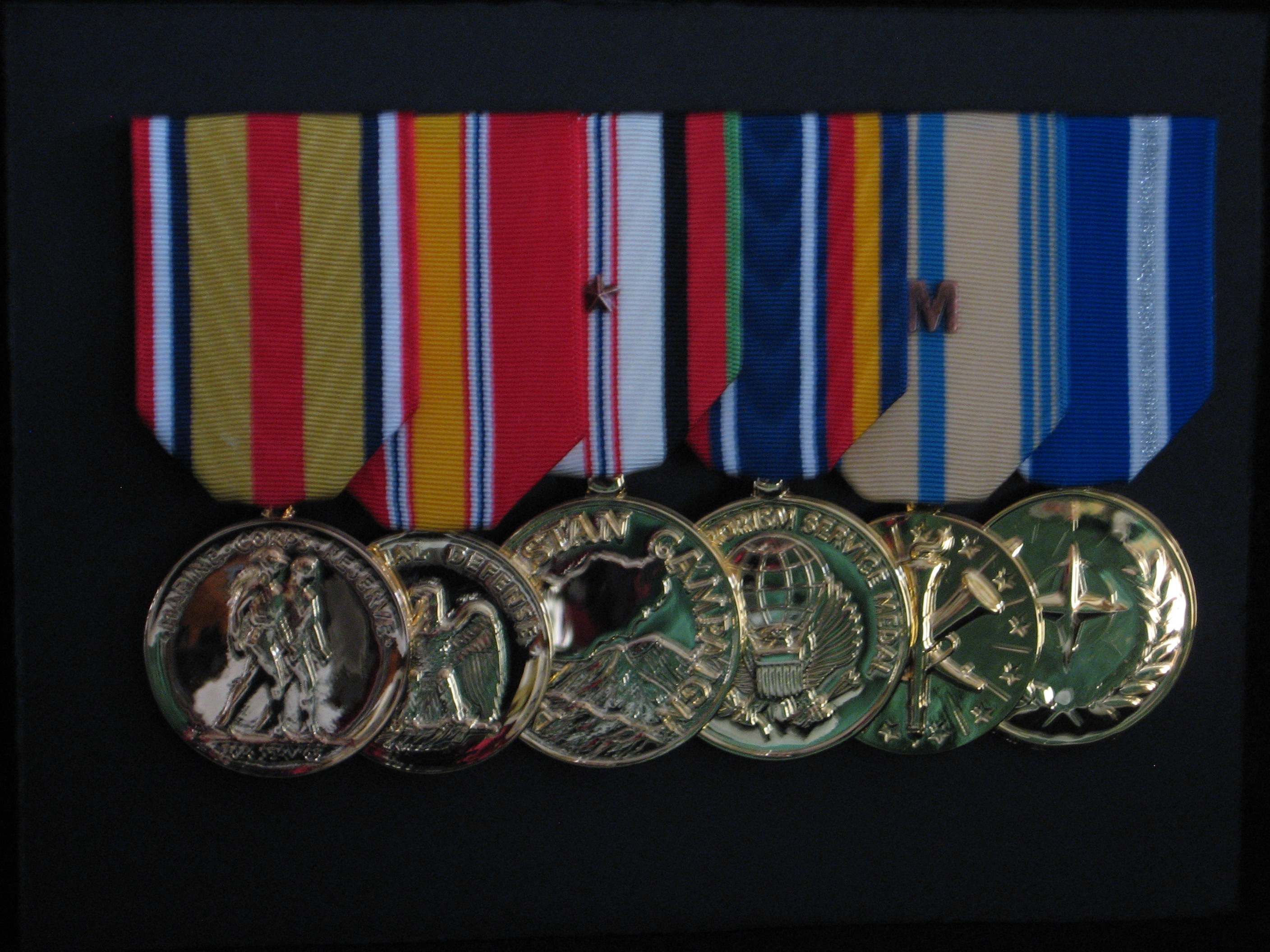 A superb medal mounting and framing completed by us for one of our